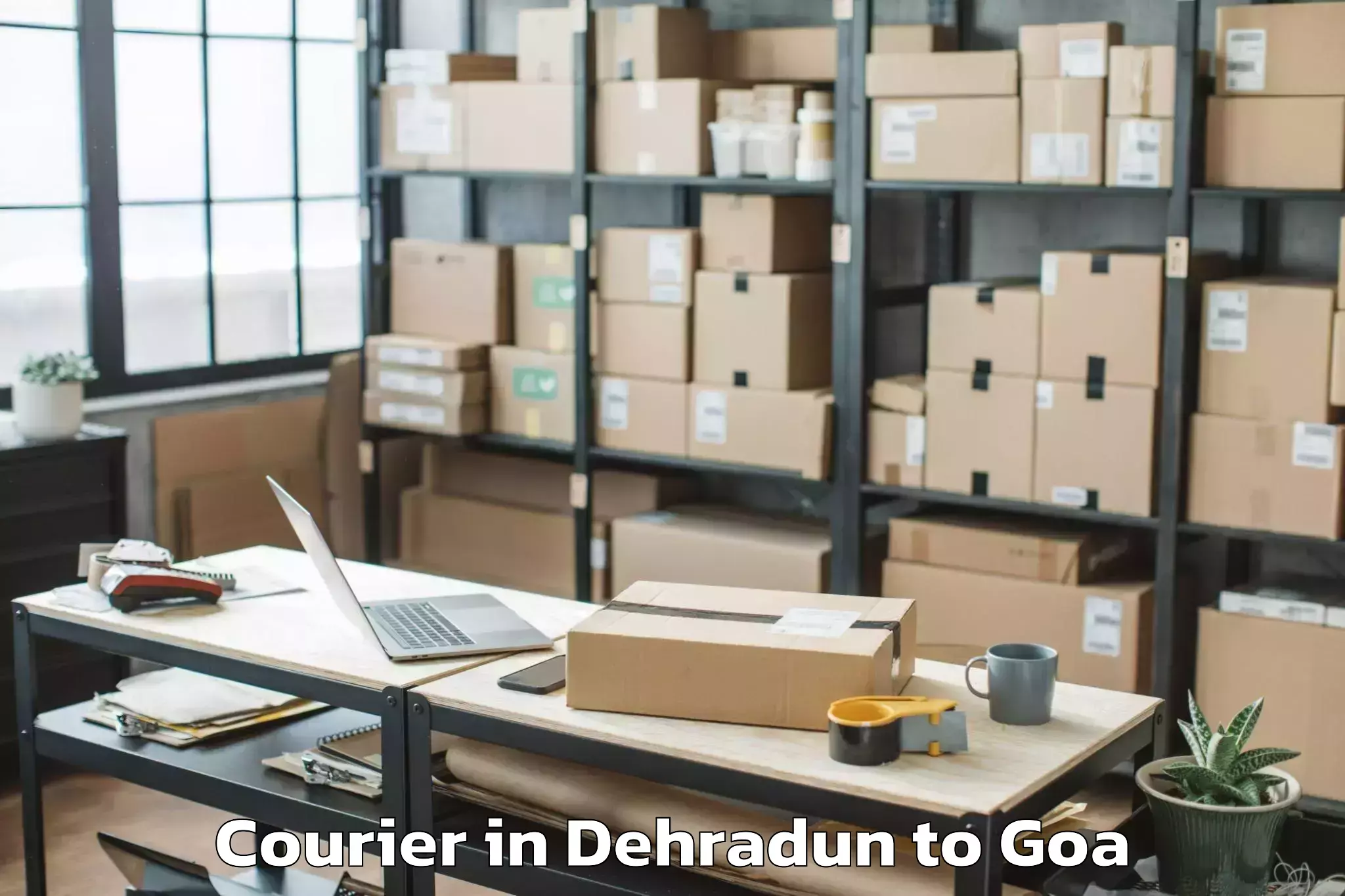 Affordable Dehradun to Mopa Courier